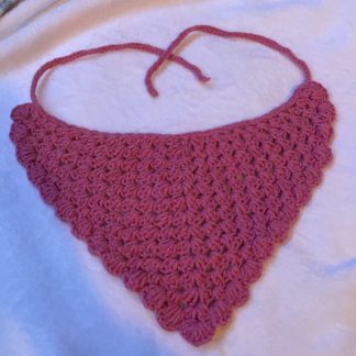 A crocheted pink bandana with scalloped edges.